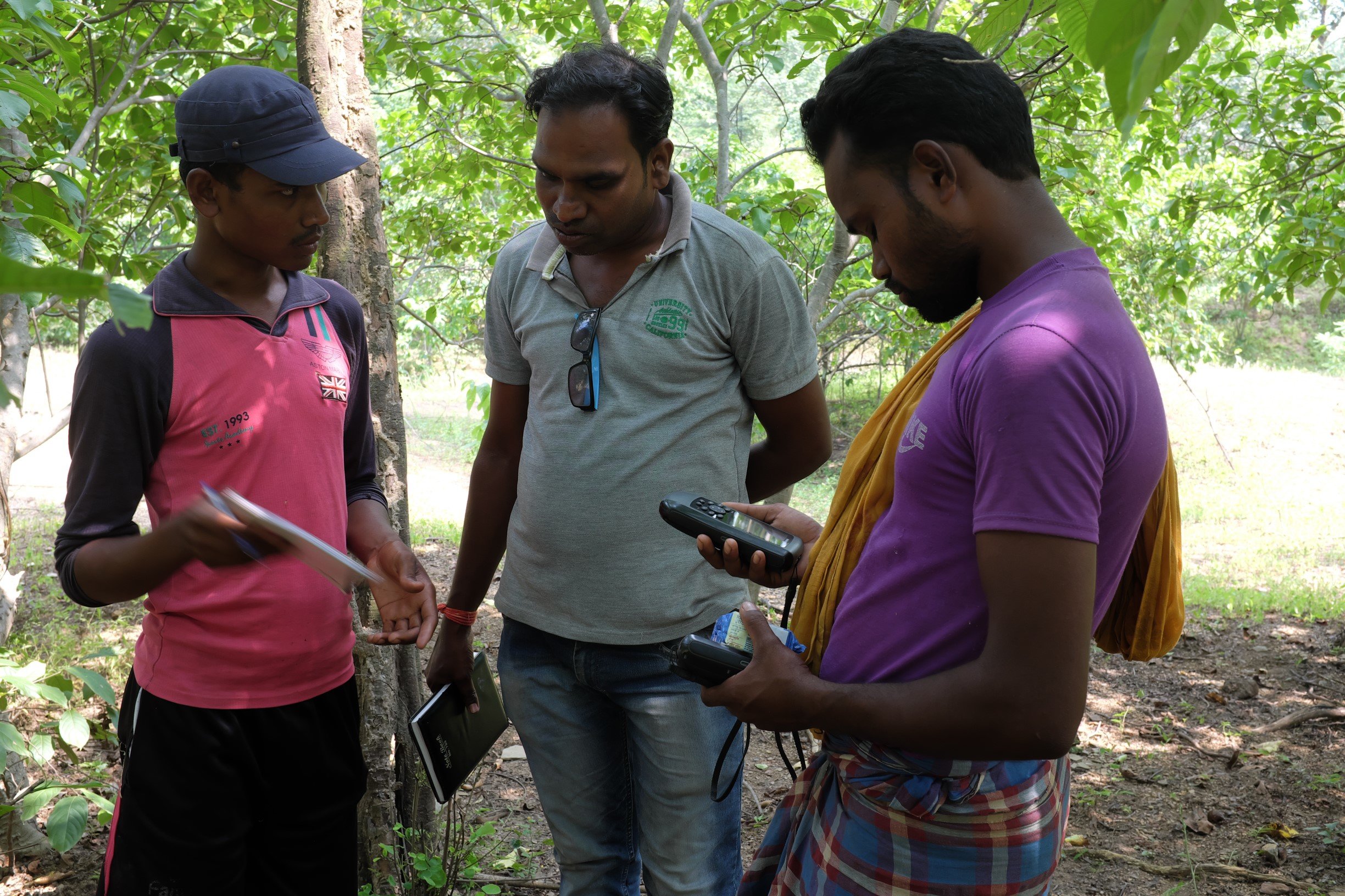 Villagers receiving GPS training from KHOJ staff.